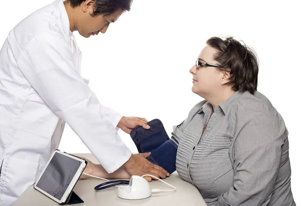 Patient with Doctor using a Smart or Digital Blood Pressure Monitor — Stock Photo, Image