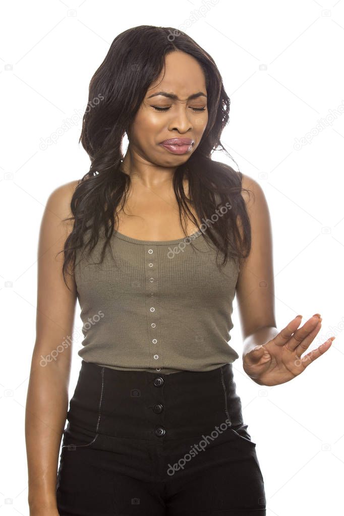 Black Female on a White Background with Disgust Gestures and Expressions