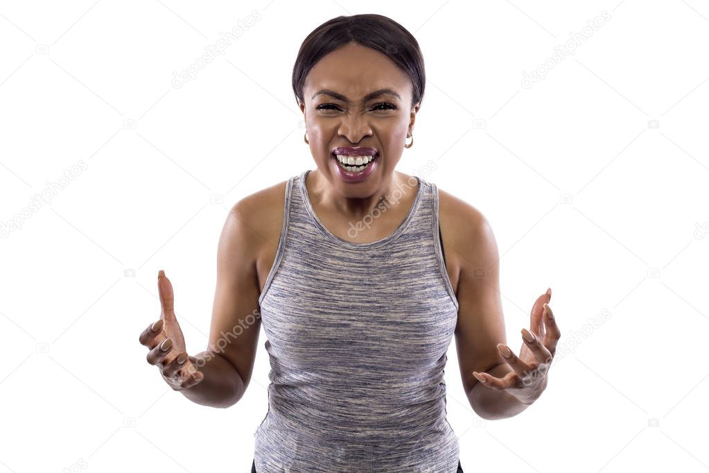 Black female wearing athletic outfit on a white background as a fitness trainer yelling or shouting