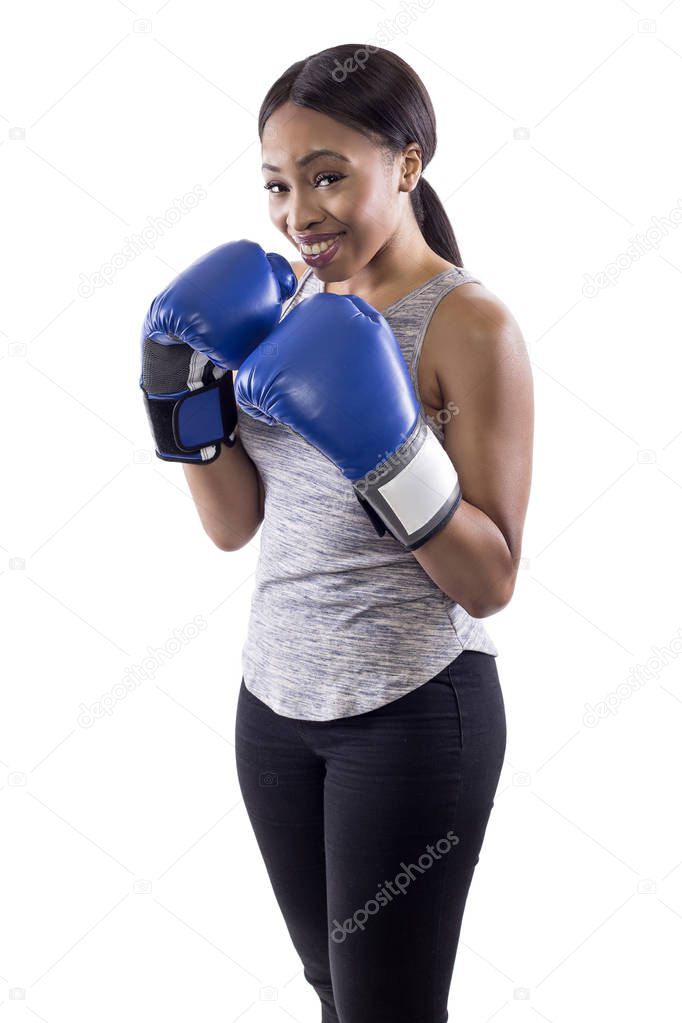Black female on a white background wearing boxing gloves looking nervous.  Part of image set for gritty woman series.