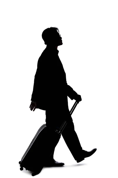 Silhouette Eines Geschäftsmannes Der Auf Geschäftsreise Ist Und Mit Gepäck — Stockfoto