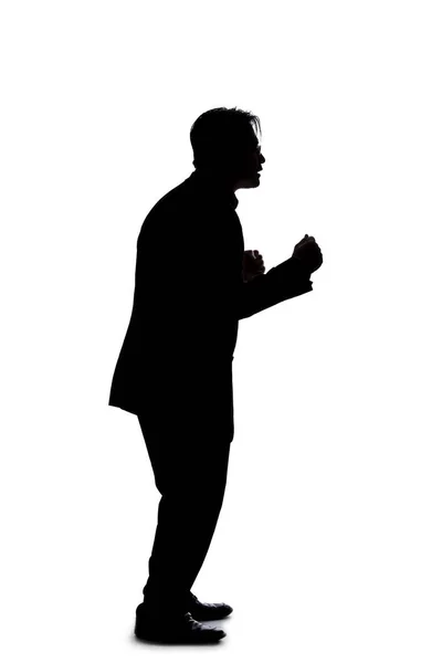 Full body silhouette of a businessman isolated on a white background. He is  standing and waiting and posed as if bored or impatient Stock Photo - Alamy