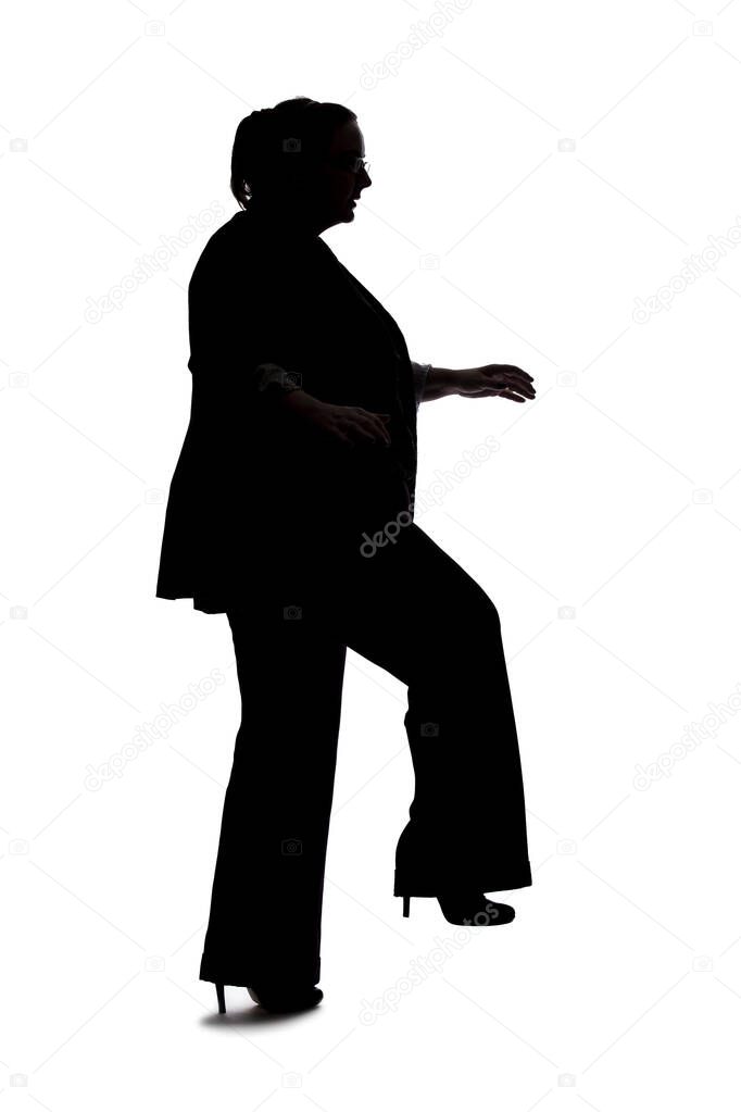 Silhouette of a curvy or plus size businesswoman on a white background for composites.  She is posed like she is falling or off balance