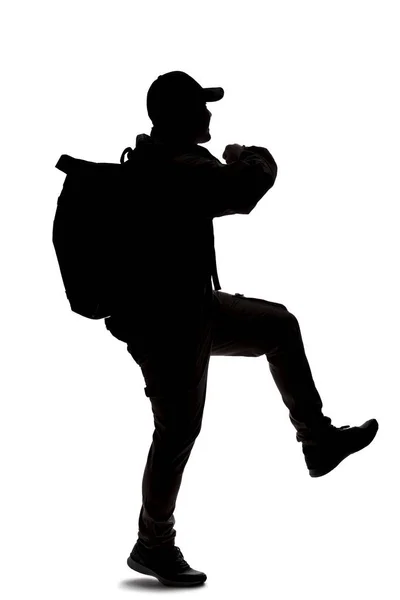 Sylwetka Mężczyzny Plecaku Wyglądającego Jak Wędrowiec Lub Wędrowiec Idzie Albo — Zdjęcie stockowe