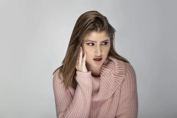 Close Portrait Young Caucasian Woman Wearing Pink Sweater Grey Background — 스톡 사진