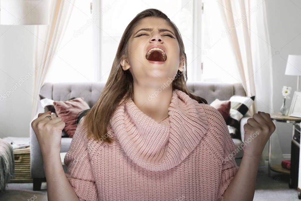 Woman getting impatient and angry for having to stay at home during pandemic lock down or quarantine.  She is upset and having a mental breakdown because of boredom or stress