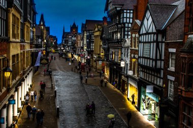 Chester city and street shops at dusk clipart