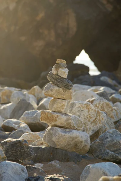 Balanced stones at portugal beach