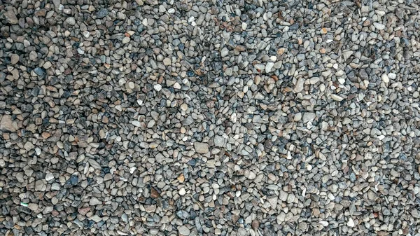 Üstte kayalık yüzey ile taş zemin, arka plan ve doku formu üzerinde. Yaz aylarında ücreti çakıl.