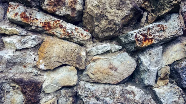 Pared vieja de piedra de bloques enormes. Fondo de piedras. El concepto de fiabilidad. Hermoso texturizado vintage antiguo fondo . — Foto de Stock