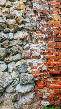Taş eski büyük bloklardan duvar. Arka plan taş. Güzel dokulu vintage antika arka plan. Eski duvar yeni tuğla bir taşla.