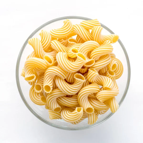 Cavatappi pasta in glass bowl on white isolated background. — Stock Photo, Image