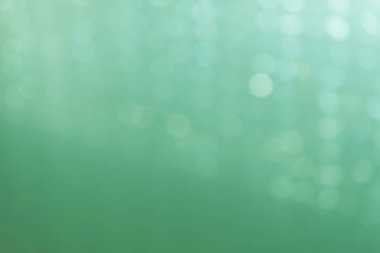 Yeşil renkli gerçek bokeh ile ışıldayan arkaplan