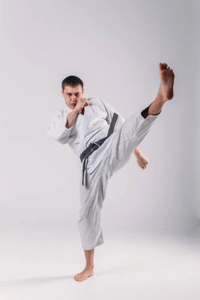 Young Strong Guy Karate White Kimono Studio White Background Performs — Stock Photo, Image
