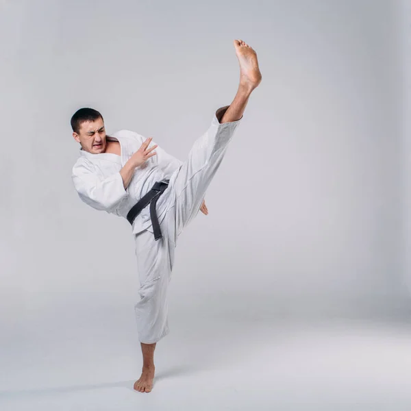 Young Strong Guy Karate White Kimono Studio White Background Performs — Stock Photo, Image