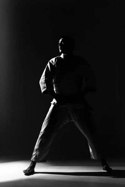 Young Strong Guy Karate White Kimono Studio Black Background Performs — Stock Photo, Image