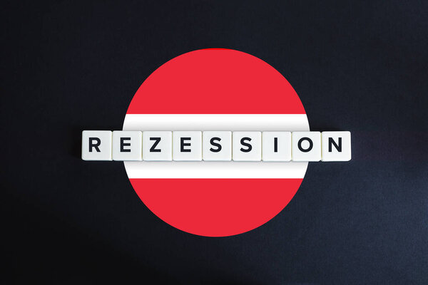 Austria facing recession (rezession) and decline of economy due to coronavirus or covid-19 crisis. Austrian flag and block letters on black background.