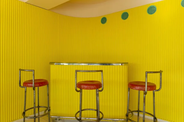 Villa Stenersen Interior Design with vibrant yellow wall. This iconic house is one of the most significant examples of Norwegian Modernism. It is designed by famous Arne Korsmo and it is located in Oslo, Norway.