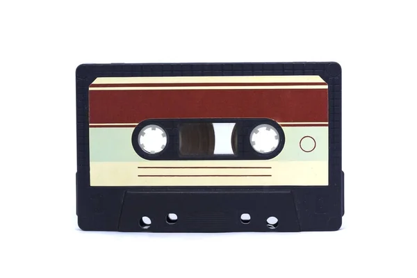 Beyaz izole edilmiş arka plan üzerinde çıkartmalar olan eski model bir kaset. Retro vintage 80 'lerin müzik konsepti