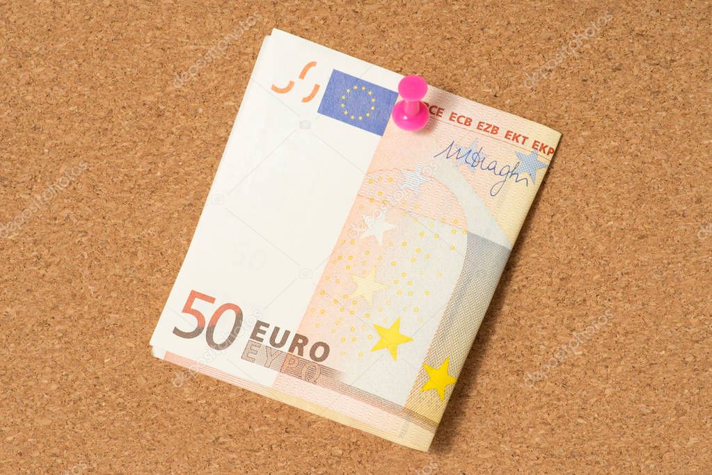 A 50 Euro bill on a whiteboard