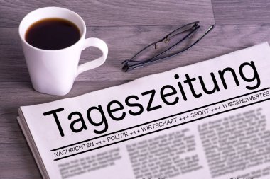 Bir fincan kahve ve bir Alman gazetesi