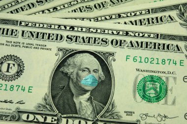 Dolar banknotu, koruyucu maske ve korona virüsü.