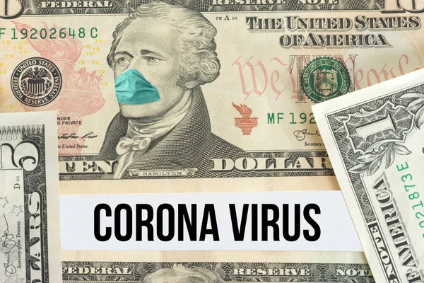 Dolar banknotu, koruyucu maske ve korona virüsü.