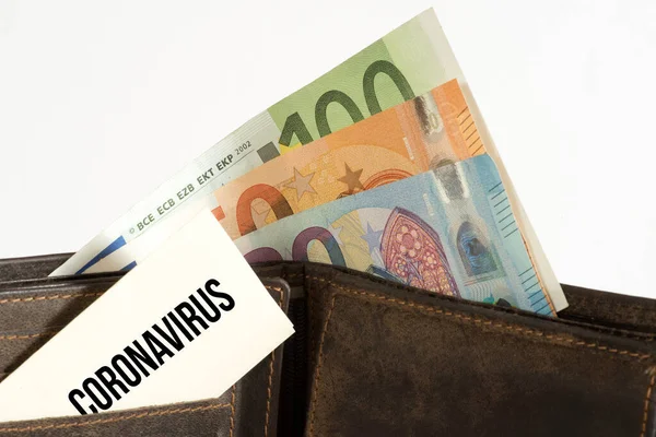 Wallet, euro banknotes and corona crisis