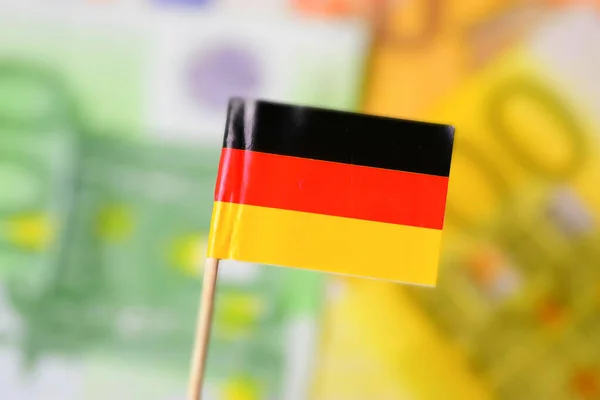 Flag of Germany and euro banknotes in the background