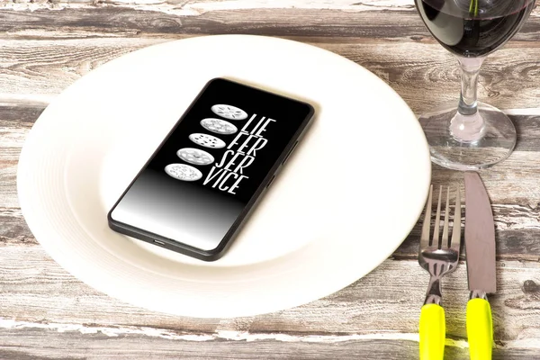 Smartphone on the empty plate and app for food delivery service