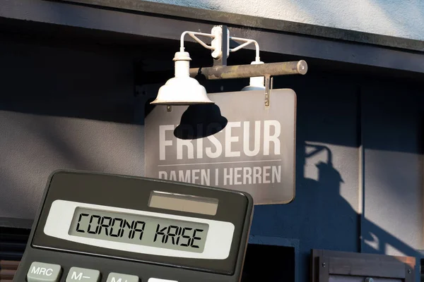 A hairdresser, calculator and cost of corona crisis