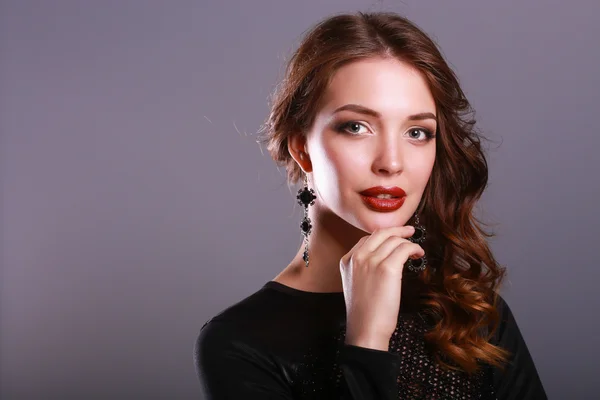 Beautiful woman with evening make-up in black dress Royalty Free Stock Photos