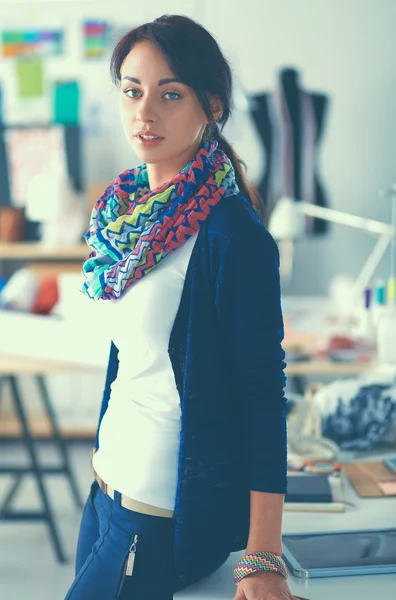 Beautiful fashion woman designer standing in studio — Stock Photo, Image