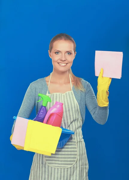 Cheerful woman is cleaning something with wisp and spray attentively. — Stock Photo, Image