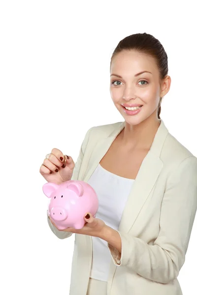 Young beautiful woman standing with piggy bank money box, isolated on white background — Stock Photo, Image