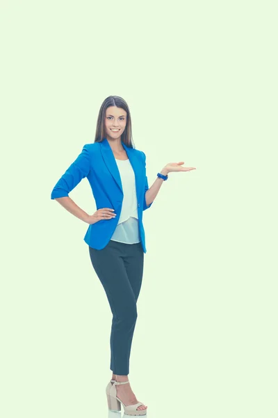 Portrait of young business woman pointing on white background — Stock Photo, Image