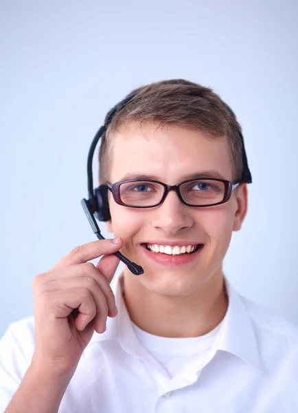 Υποστήριξης πελατών χειριστή με ένα ακουστικό σε άσπρο φόντο — Φωτογραφία Αρχείου