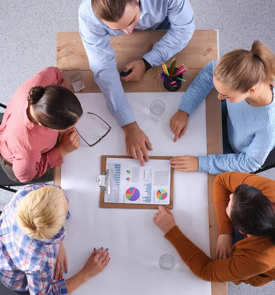 Business people sitting and discussing at meeting, in office — Stock Photo, Image