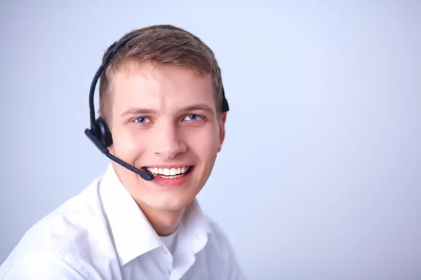 Customer support operator with a headset on white background — Stock Photo, Image