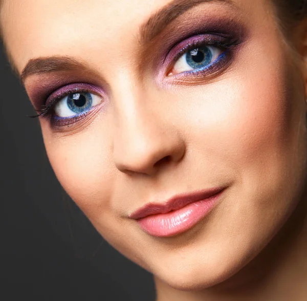 Studio shot of a beautiful young woman wearing professional makeup — Stock Photo, Image