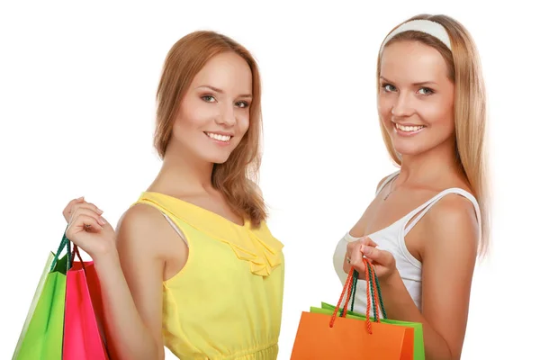 Gelukkig vrouwen met boodschappentassen geïsoleerd op witte achtergrond — Stockfoto