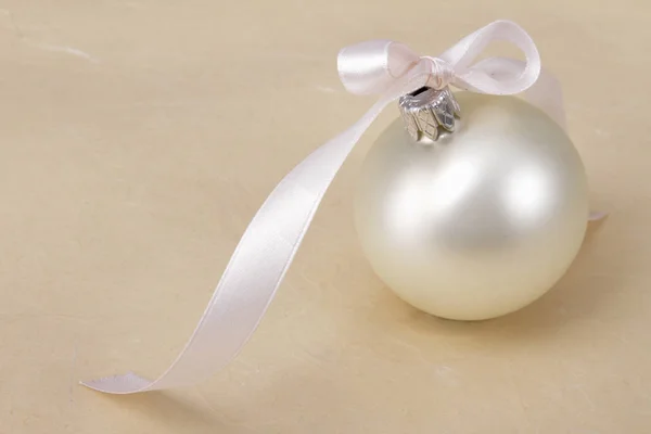 White christmas ball , isolated on beige background — Stock Photo, Image