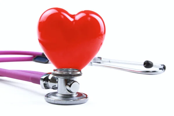 Red heart and a stethoscope on desk — Stock Photo, Image