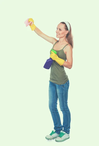 Cheerful woman is cleaning something with wisp and spray attentively. — Stock Photo, Image