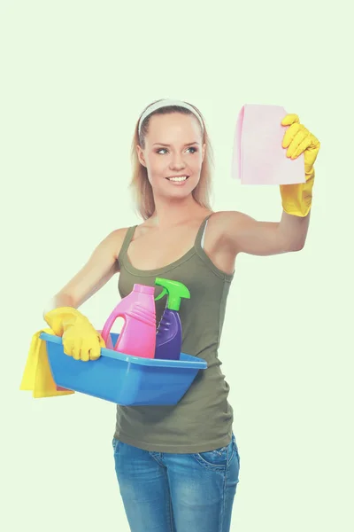 Cheerful woman is cleaning something with wisp and spray attentively. — Stock Photo, Image