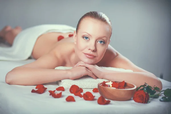 Beautiful young woman getting spa massage, lying — Stock Photo, Image