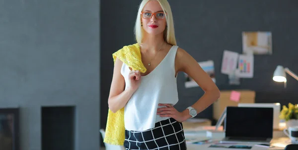 Young fashion designer woman working in studio — Stock Photo, Image