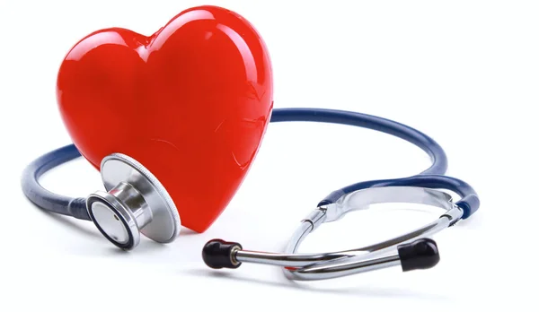 Red heart and a stethoscope on desk — Stock Photo, Image