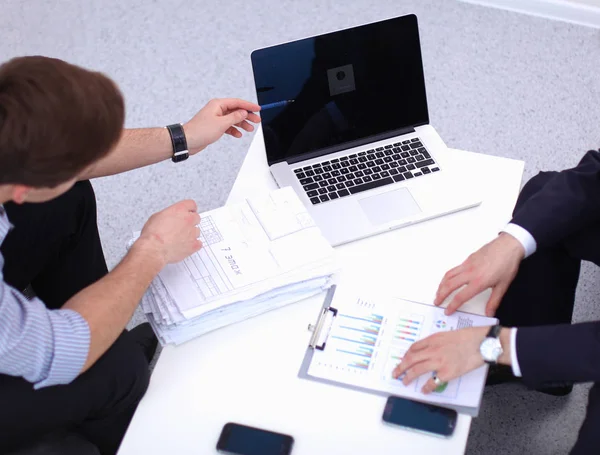 Business people sitting and discussing at meeting, in office — Stock Photo, Image