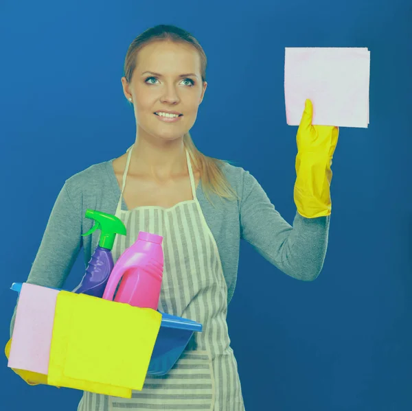 Cheerful woman is cleaning something with wisp and spray attentively. — Stock Photo, Image